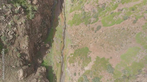 Aerial overhead on the small river in Yolyn Am canyon in Gobi, southern Mongolia photo