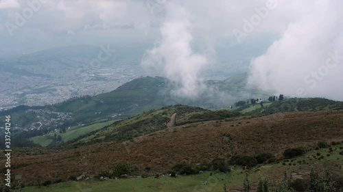 Pan view of Quito city from top of mountain and cloudy day, Equador