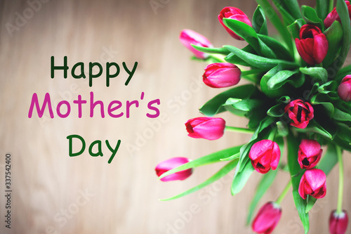 Canvas Print bouquet of tulips on wooden background with Happy Mother's Day Message