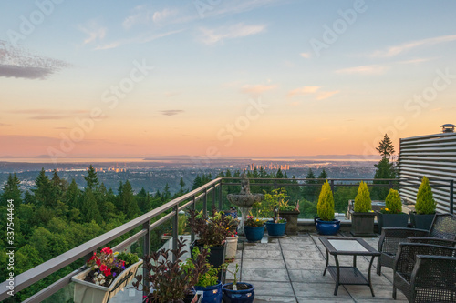 panoramic view across Fraser River to gulf islands on far horizon - summer sunset on Burnaby Mountain patio 