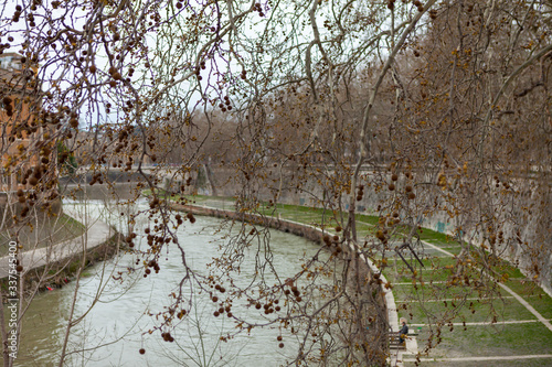 Tber (Tevere or Tiberis) embankment from the Pons Fabricius (Ponte Fabricio or Ponte dei Quattro Capi), bridge in Rome, Italy. photo