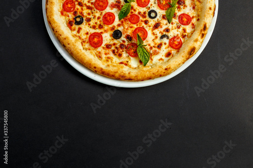 hot italian pizza with cheese and basil, isolated