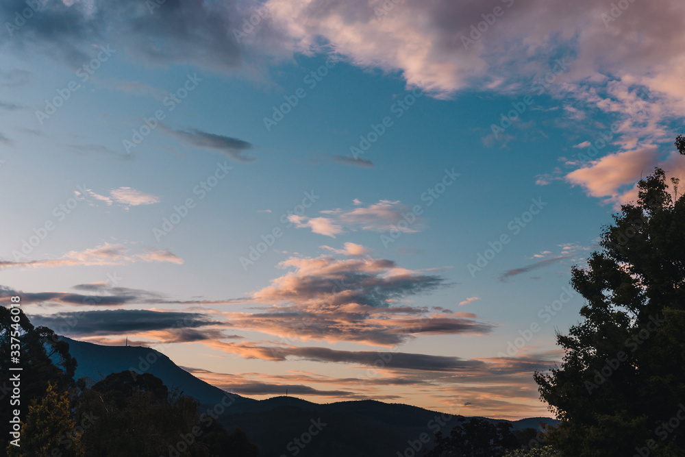 sunset sky over the hills and mountains in Tasmania, Australia with deep tones