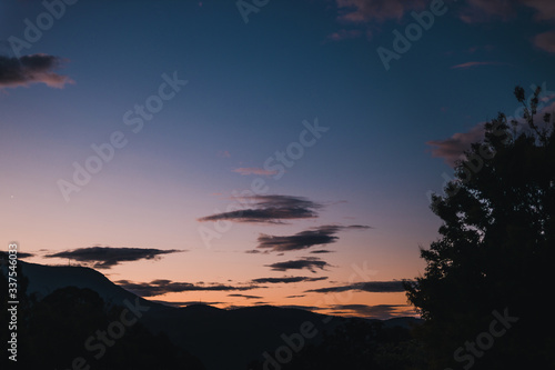 sunset sky over the hills and mountains in Tasmania  Australia with deep tones