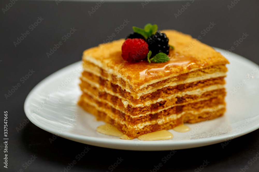 a slice of honey cake with berries, sweet dessert a slice of honey cake with berries, sweet dessert