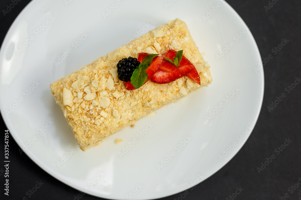 a slice of honey cake with berries, sweet dessert a slice of honey cake with berries, sweet dessert