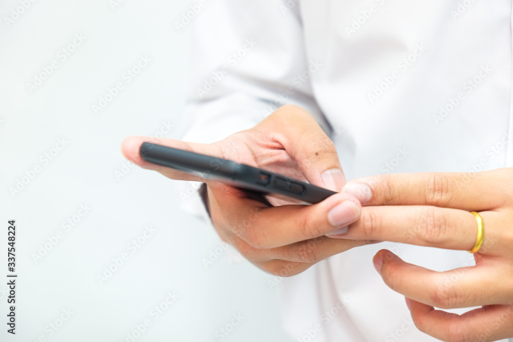 Business man hand use smartphone on white background close up on hand Business man hand use smartphone on white background close up on hand