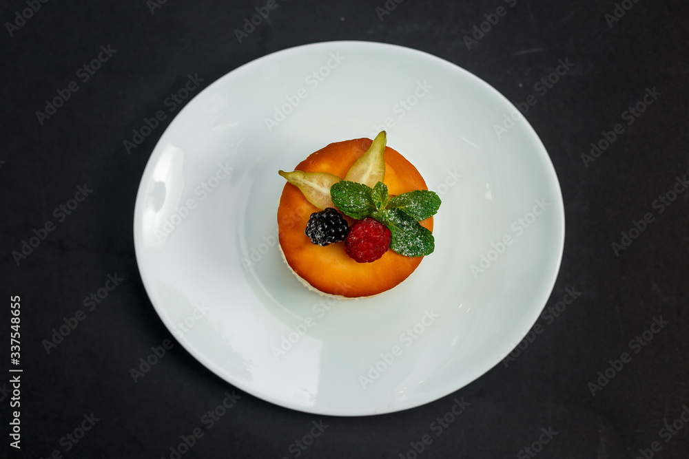 delicious cheesecake with raspberry flavor with berries, powdered sugar and mint, dessert delicious cheesecake with raspberry flavor with berries, powdered sugar and mint, dessert