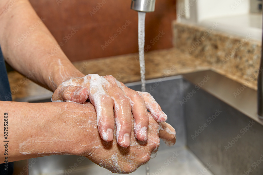 A Man's Hands with Soap and Water A Man's Hands with Soap and Water