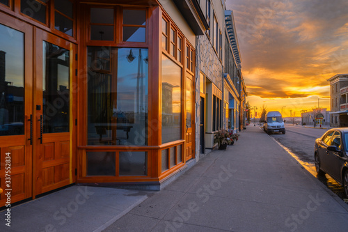Sunset reflected in store front windows of Fort MacLeod, Alberta, Canada photo