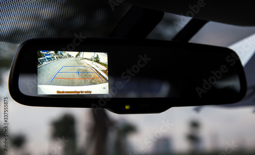 Rear mirror, with integrated camera working