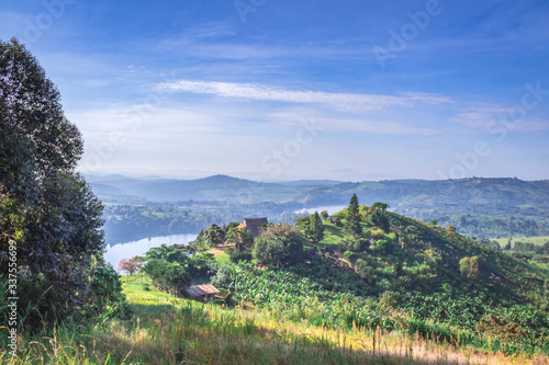 View of green mountains with a Crater Lake and the reflections on the water, Rweteera, Fort Portal, Uganda, Africa
 photo