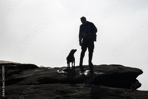 silhouette of a man and dog