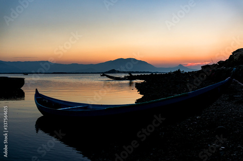 Traditional Boat and location fisherman on the beach at sunrise time, Hon Thien village, Phan Rang, Vietnam © Hien Phung