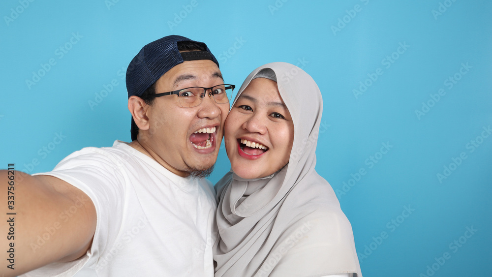 Happy Asian Muslim Couple Making Selfie