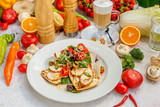 panini with chicken and vegetables on a plate on a decorated table