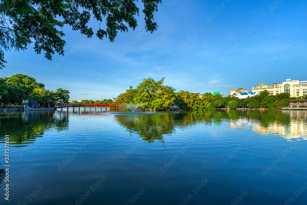 The Huc bridge (red bridge), entrance of Ngoc Son temple on Hoan Kiem lake, Hanoi, Vietnam