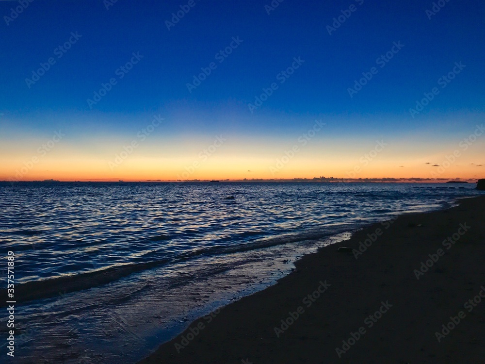 Scenic View Of Sea Against Clear Sky At Sunset