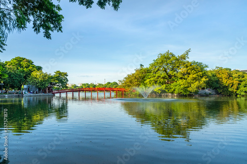 The Huc bridge (red bridge), entrance of Ngoc Son temple on Hoan Kiem lake, Hanoi, Vietnam photo