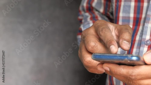 Wallpaper Mural Close up of man hand use smart phone indoor. Torontodigital.ca