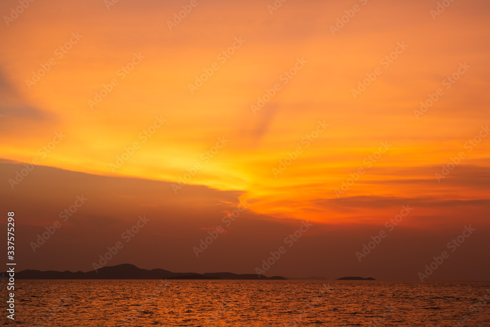 The islands with the reflection of the orange sky.