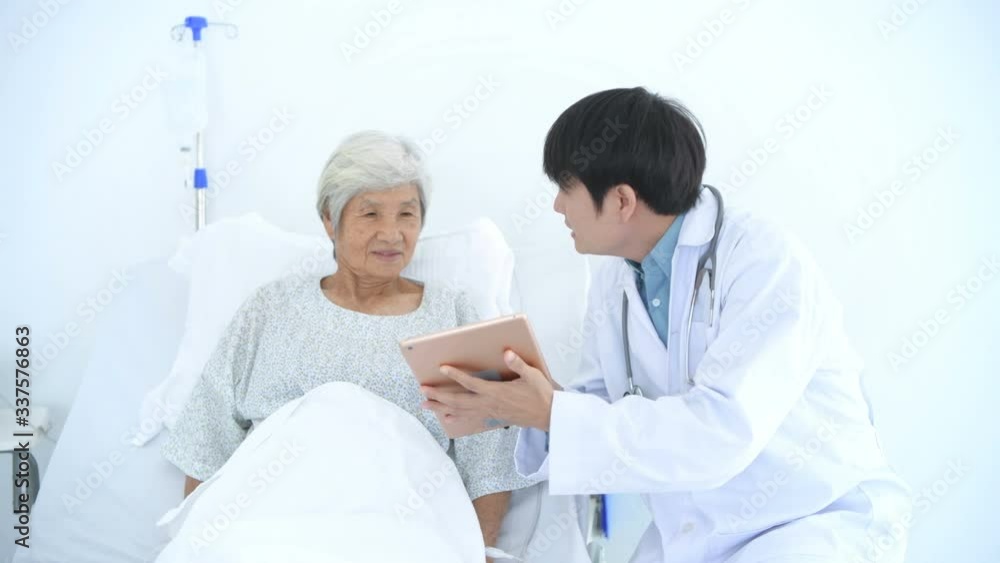 Medical concepts. The doctor described the treatment to the patient using a tablet in the hospital. 4k Resolution. Medical concepts. The doctor described the treatment to the patient using a tablet in the hospital. 4k Resolution.
