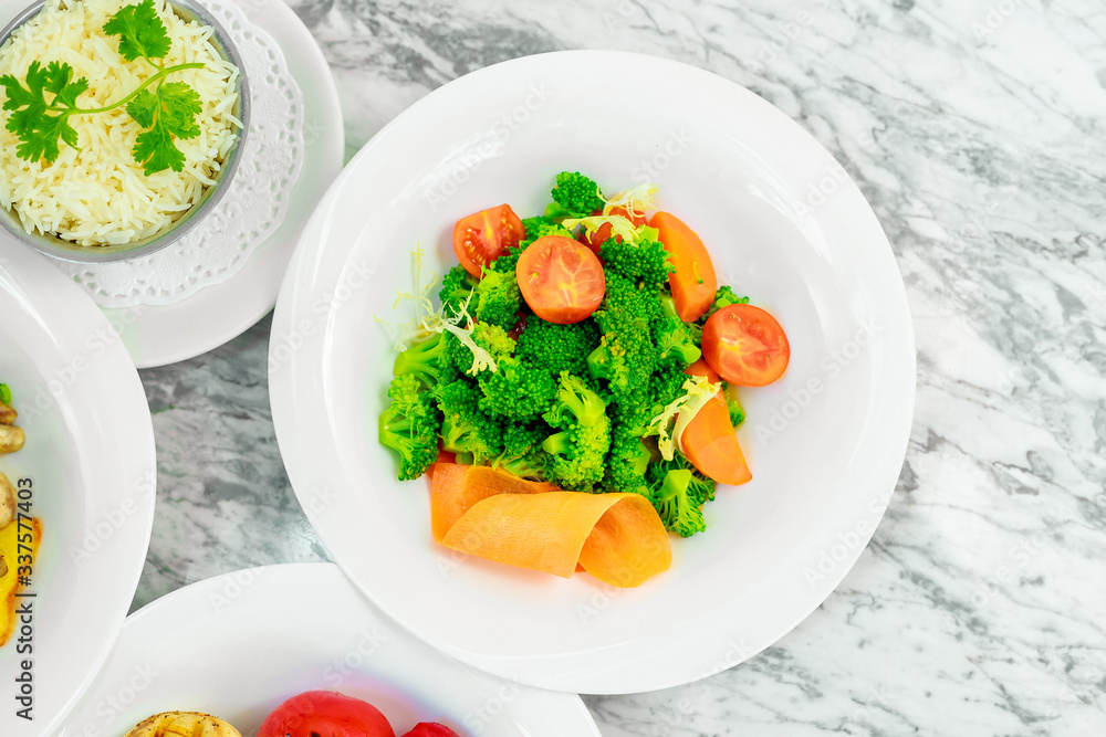 side dishes for the main course,fresh vegetables tomatoes and broccoli, beautiful serving side dishes for the main course,fresh vegetables tomatoes and broccoli, beautiful serving