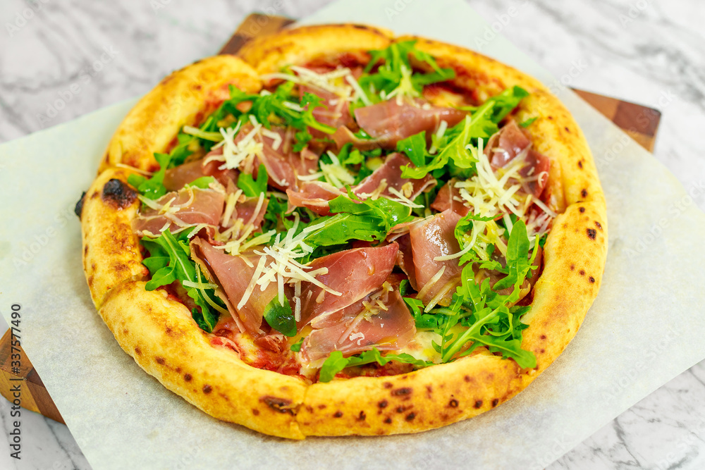Italian pizza with mozzarella and basil Italian pizza with mozzarella and basil