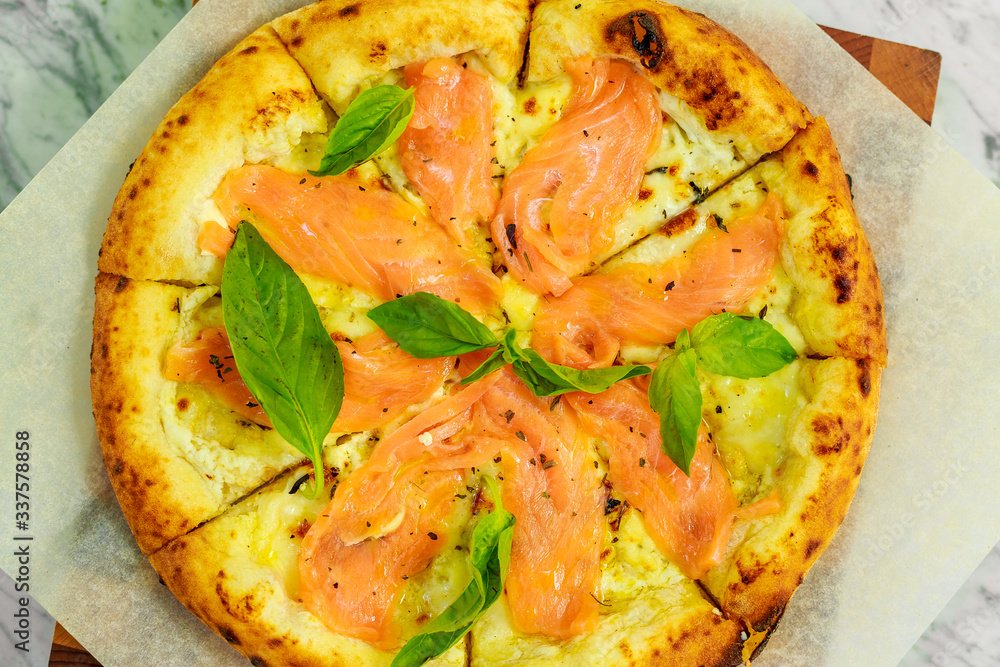 Italian pizza with mozzarella and basil Italian pizza with mozzarella and basil