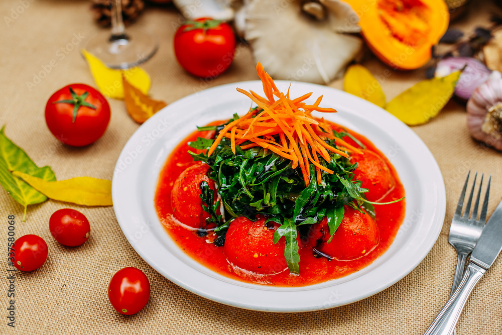 Autumn table setting with pumpkins. Thanksgiving dinner. pickled tomatoes with arugula and carrots. Vegetarian healthy food. Autumn table setting with pumpkins. Thanksgiving dinner. pickled tomatoes with arugula and carrots. Vegetarian healthy food.