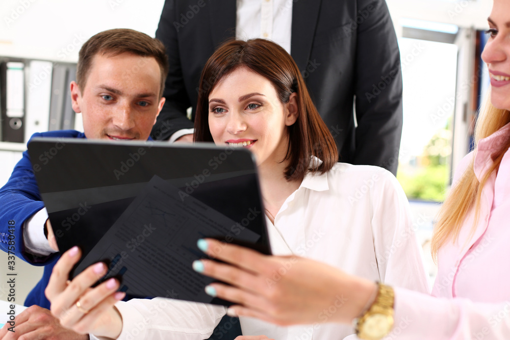 Group of people in office look at mobile tablet pc. Funny internet video, white collar colleague share job plan at workplace, busy lifestyle, corporate style, new worker interview, web search concept Group of people in office look at mobile tablet pc. Funny internet video, white collar colleague share job plan at workplace, busy lifestyle, corporate style, new worker interview, web search concept