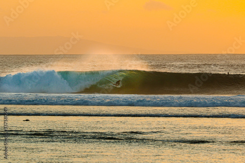 Photography View of man surfing in sea during sunset