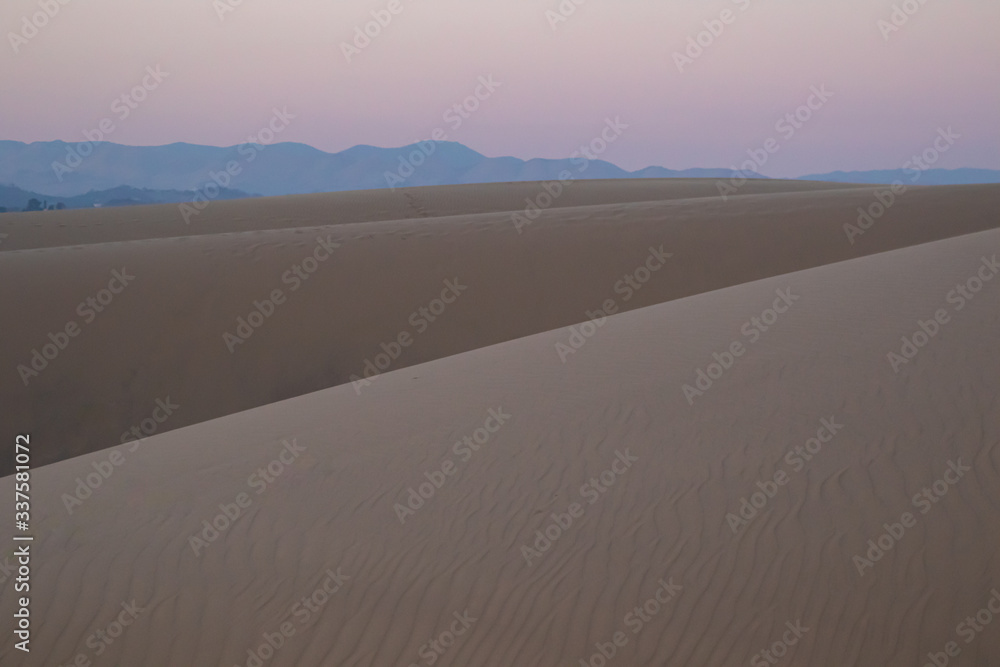 View of sand dunes during sunrise