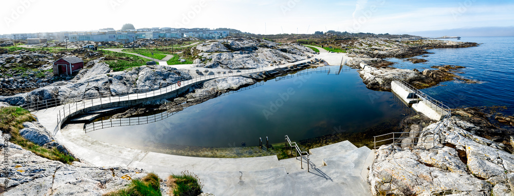 Scenic panoramic view of a mirror like swimming sea pool for public us at Sjobadet Myklebust, Tananger, Norway, May 2018