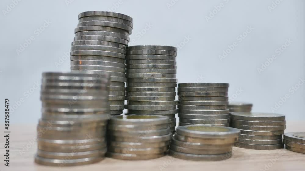 Coins stack, real estate, and bank saving concepts Coins stack, real estate, and bank saving concepts