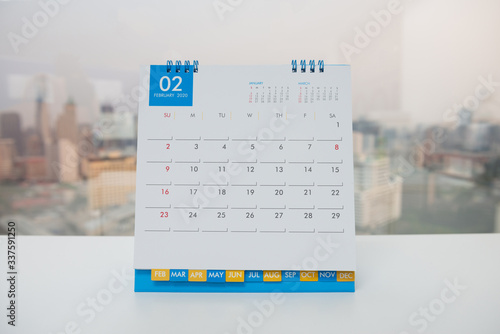 Close up - Calendar of February on the white table with city view background