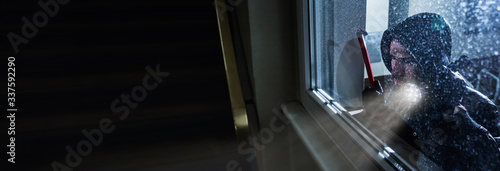 Burglar Looking Into A House Window