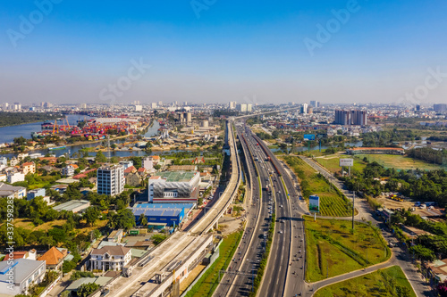 Top view aerial of Ha Noi highway view from district 2 to district 9, Ho Chi Minh City with development buildings, transportation, infrastructure, Vietnam. 