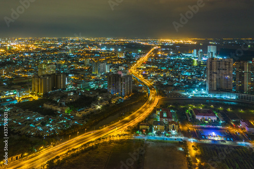 Top view aerial of Nguyen Van Linh road, area Phu My Hung new urban, Ho Chi Minh City with development buildings, transportation, energy power infrastructure. Financial  in developed Vietnam.