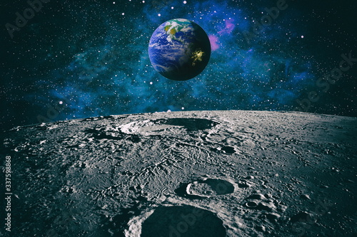 Moon limb with Earth rising on the horizon.Earth rises above lunar horizon. Elements of this image furnished by NASA.
