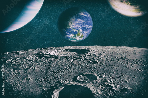 Moon limb with Earth rising on the horizon.Earth rises above lunar horizon. Elements of this image furnished by NASA.