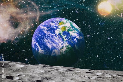 Moon limb with Earth rising on the horizon.Earth rises above lunar horizon. Elements of this image furnished by NASA.