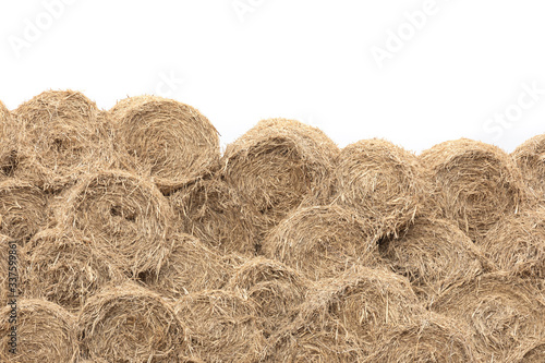 A big of hay stack Wall - Straw bales. isolated on white background. photo