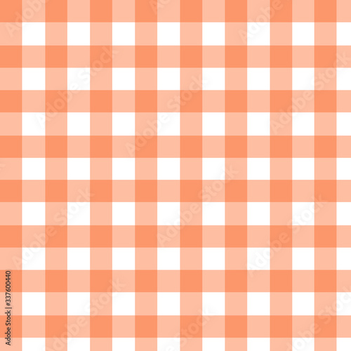 Plaid pattern in orange and white. Seamless fabric texture print.