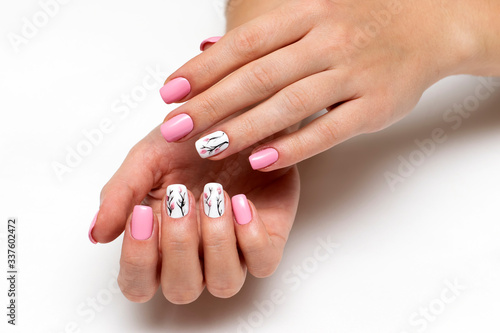delicate pink manicure with spring flowers on short square nails on a white background 