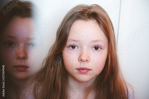 Portrait of a girl and her reflection