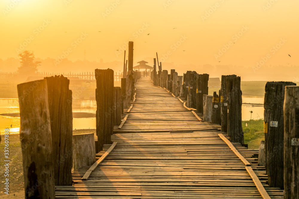 Royalty high quality free stock image of silhouettes of people and Bridge U-Bein teak bridge is the longest. in Amarapura ,Mandalay ,Myanmar Royalty high quality free stock image of silhouettes of people and Bridge U-Bein teak bridge is the longest. in Amarapura ,Mandalay ,Myanmar