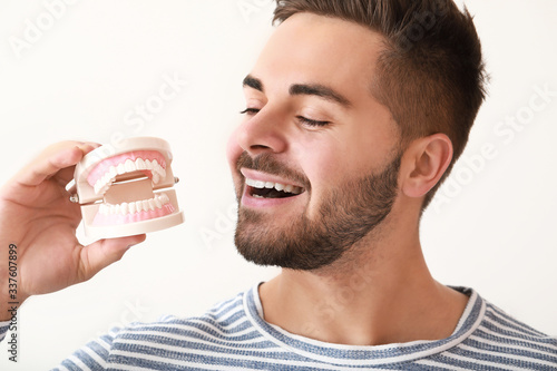 Happy smiling young man wit...