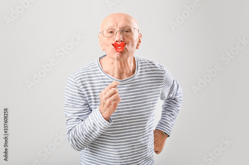Portrait of elderly man wit...
