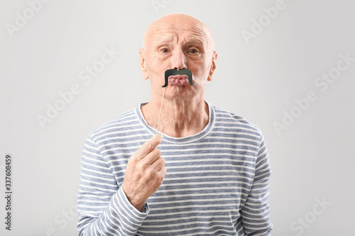 Portrait of elderly man wit...